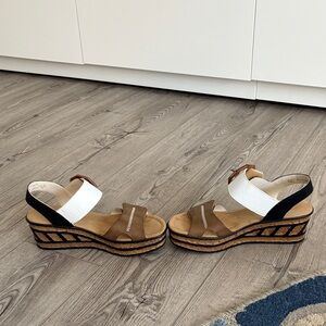 Rieker Brown and White Wedge Sandals. Velcro opening at the foot and ankle.